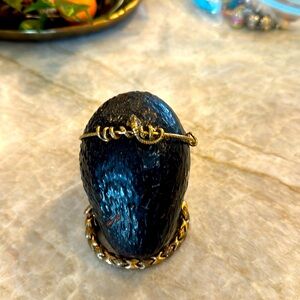 Alex and Ani serpent bracelet, dark gold with textured band.